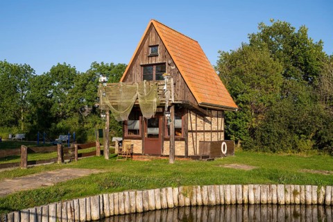 House with hanging fishing nets on the Achterwasser, Ückeritz, Usedom Island, Baltic Sea,