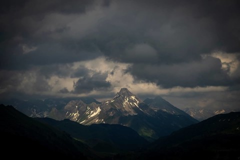Summit of the Biberkopf with remnants of snow and dramatic clouds, Lech, Lechquellengebirge,