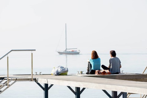 Two woman on a jetty, Immenstaad, Lake Constance, Baden-Württemberg, Germany, Europe