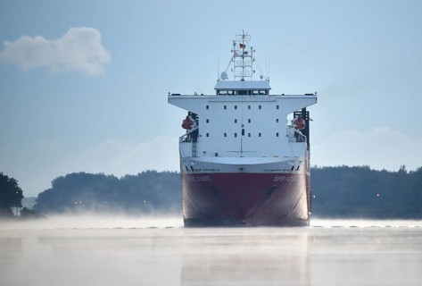 RoRo cargo ship Super Fast Levante travelling through the Kiel Canal at sunrise, Kiel Canal,