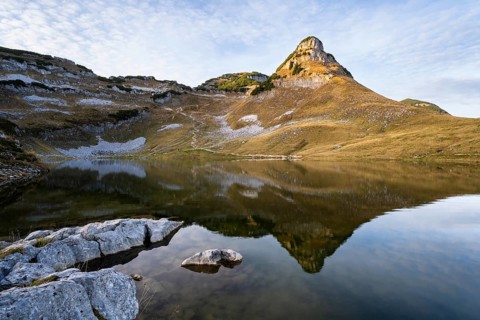 Lake Augstsee and the Atterkogel mountain on the Loser. Autumn, good weather, blue sky, little