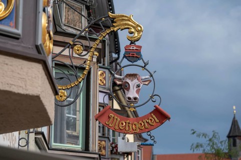 Nose sign with a cow's head of a butcher's shop, Rottwei, Baden-Württemberg, Germany, Europe