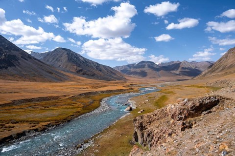 Burkhan valley with blue river, mountain landscape with golden meadows, Terskey Ala-Too, Tien Shan,