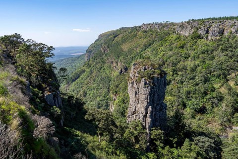 Rock needle in a densely forested canyon, Pinnacle Rock, view over canyon landscape, near Graskop,