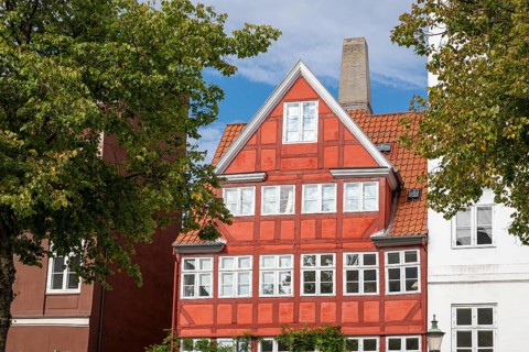 Old, red-painted half-timbered house, Christianshavns Kanal, Copenhagen, Denmark, Europe