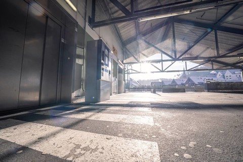 Entrance area with light beams and city view through the steel structure, Kaufland Calw