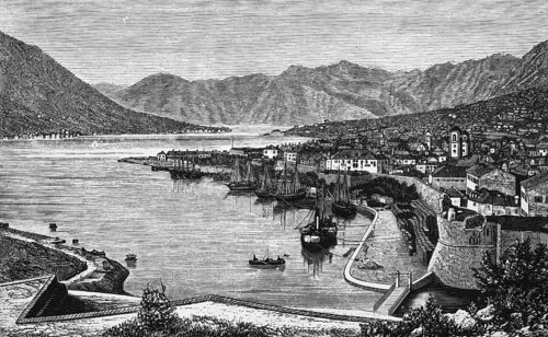 Old town of Kotor or Cattaro in the Bay of Kotor, city wall with round tower, mountain landscape,