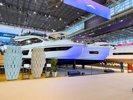 View of exhibition stand with luxury yacht superyacht ship boat in front Azimut Fly 53 behind