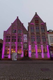 Medieval houses with illuminated facades, Eulenspiegel Museum, twilight, Damme, West Flanders,