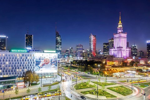 Warsaw skyline skyscrapers with Palace of Culture in the city centre at night in Warsaw, Poland,