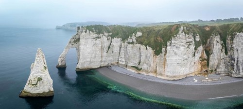 Aerial view of La Porte d'Aval and l'Aiguille on the Alabaster Coast in light fog, Etretat,