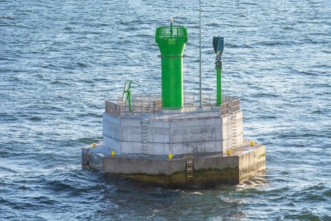 Small lighthouse on navigation mark in Baltic Sea outside Swinoujscie, Poland, Europe