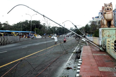 Street lamp post that came in the path of Cyclone Vardah, lie uprooted in Chennai, India on