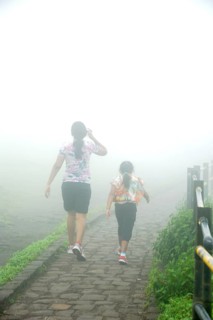 Mother and daughter walking to Sinhagad fort, Pune, Maharashtra, India, Asia, MR#364, Asia