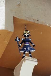 Demon doll outside Dagadusheth Halwai Ganapati Temple, Pune, Maharashtra, India, Asia