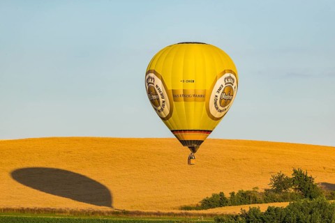 Summer balloon flight over the foothills of the Osterzgebirge mountains