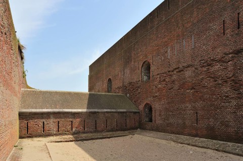 The pentagonal Fort Napoleon with caponier with gun ports and dry ditch in the dunes near Ostend,