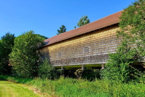 The covered wooden bridge Beuron is a historic bridge over the Danube near the Benedictine