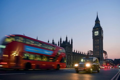 Red double-decker bus on Westminster Bridge, blue hour, Big Ben in the background, Westminster,