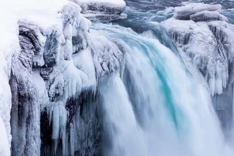 Godafoss waterfall, icy and snowy rock face, Northern Iceland Eyestra, Iceland, Europe