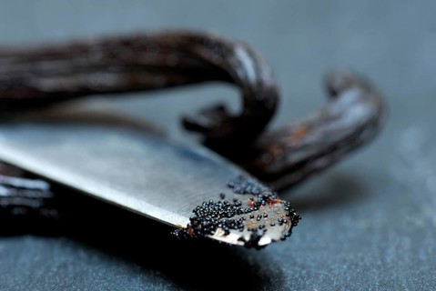 Vanilla sticks, vanilla pulp on knife point (Vanilla planifolia)