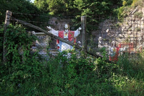 Jesus figure by the road, fenced in, road accident memorial, Campania, Italy, Europe