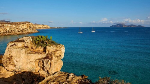 Rock, sailing boats, Levanzo Island, Scogliera di Cala Rossa, Cala Rossa, Favignana, Egadi Islands,