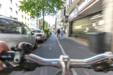 Cycling from a first-person perspective on a cycle path in Cologne, North Rhine-Westphalia,