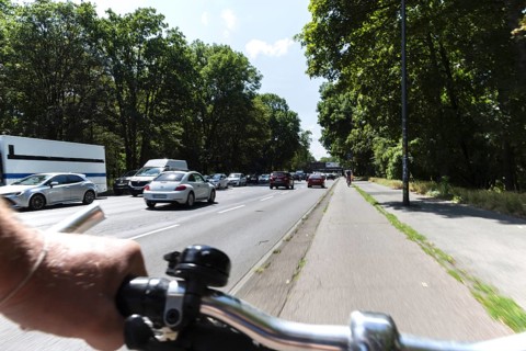 Cycling from a first-person perspective on a cycle path in Cologne, North Rhine-Westphalia,