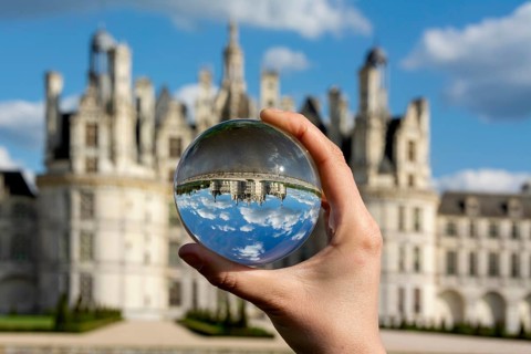 View of the Chateau de Chambord through a transparent ball. Loir-et-Cher department, Centre-Val de