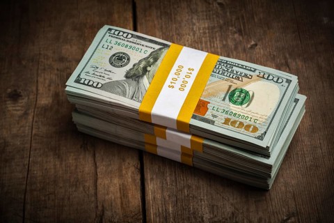 Creative business finance making money concept, stacks of new 100 US dollars 2013 edition banknotes