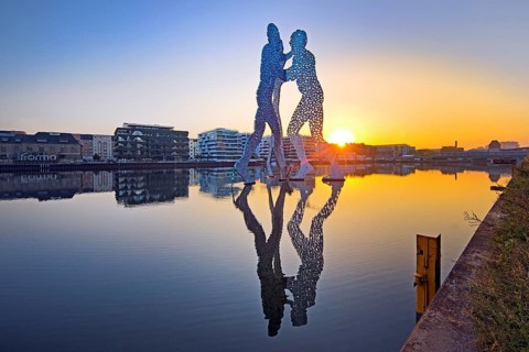 Molecule Man, monumental artwork in the Spree at sunrise, artist Jonathan Borofsky, Berlin,