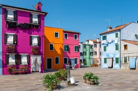 Colourful houses with washing lines and flowers, colourful house facades, alleyways on the island