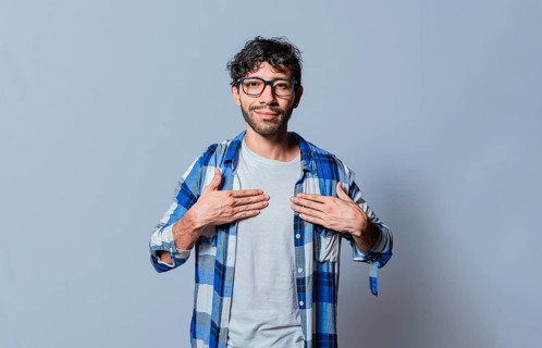 Smiling person gesturing the word HAPPINESS in sign language, Interpreter man gesturing the