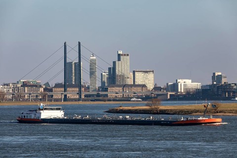 Düsseldorf, city centre skyline, skyscrapers, Rheinkniebrücke, Rhine, cargo ship