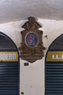 Marian picture with decorative frame in the old arcades at the harbour, Genoa, Italy, Europe