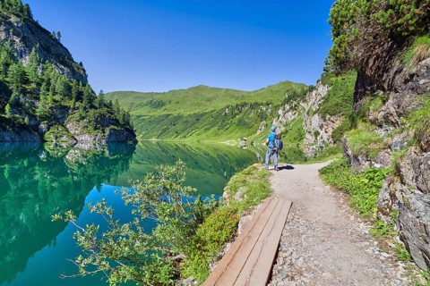 Hikers at Tappenkarsee, reflection, mountain lake, Radstätter Tauern, landscape conservation area,