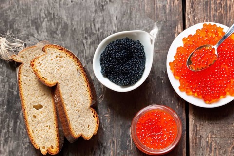 Different kinds of caviar with bread and beverages, AI generated