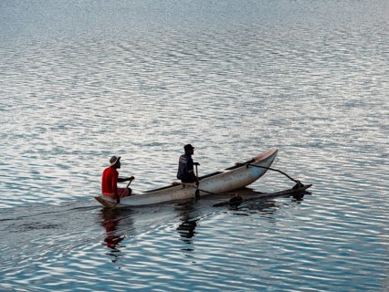 Small boat with two men, Kandalama Lake, Dambulla, Sri Lanka, Asia