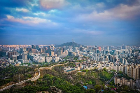 Aerial view of Seoul downtown cityscape and Namsan Seoul Tower on sunset from Inwang mountain.