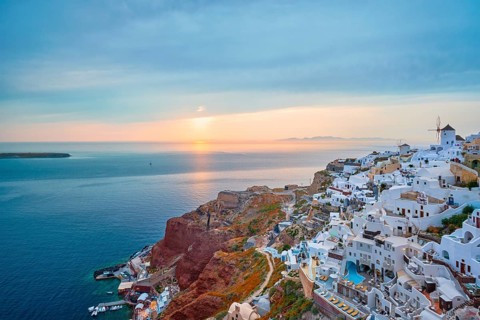 Famous greek iconic selfie spot tourist destination Oia village with traditional white houses and