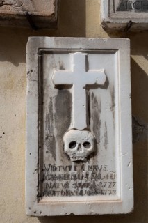 Gravestone with cross and skull, spa town of Merano, South Tyrol, Italy, Europe