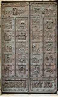 Replica of the Porta di San Ranieri with scenes from the life of Jesus and Mary, sculptor Bonanus