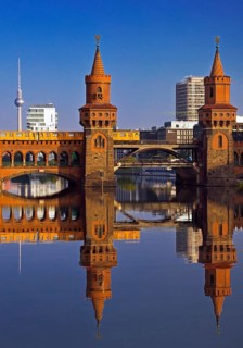 Oberbaum Bridge over the Spree with yellow underground and television tower,