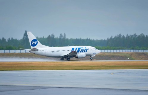 MINSK, BELARUS, JUNE 15, 2018: UTAir flight Boeing 737-500 plane taxi on runway in National Airport