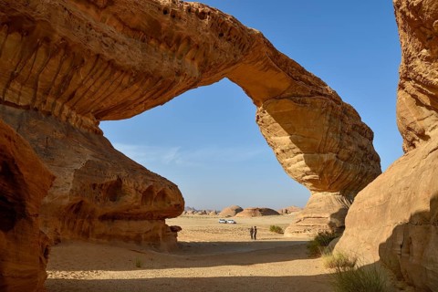 Tourists at The Arch, also known as Rainbow Rock, near AlUla, Medina Province, Saudi Arabia,