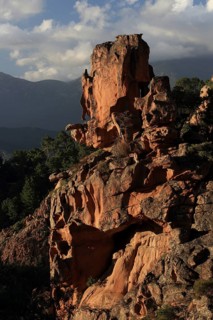 Bizarre red rock landscape in the evening light, Calanques de Piana, Corsica, France, Europe