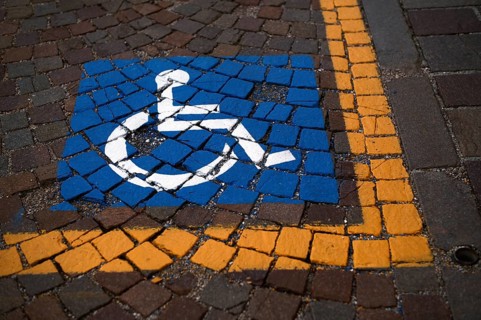 Reserved for wheelchair, severely disabled, marking on pavement, Ortisei, Val Gardena, South Tyrol,