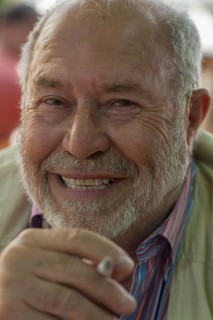 Portrait of a laughing gentleman with beard and cigarette, Bavaria, Germany, Europe