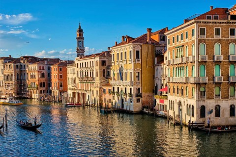 VENICE, ITALY, JUNE 27, 2018: Grand Canal with boats and gondolas on sunset, Venice, Italy, Europe